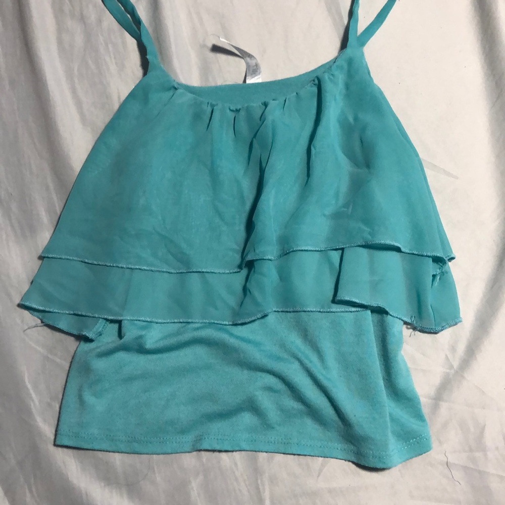 A flowy light turquoise shirt